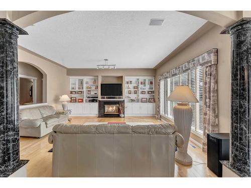 658 East Chestermere Drive, Chestermere, AB - Indoor Photo Showing Living Room With Fireplace