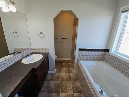 184 Silverado Plains Close Sw, Calgary, AB - Indoor Photo Showing Bathroom