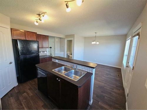 184 Silverado Plains Close Sw, Calgary, AB - Indoor Photo Showing Kitchen With Double Sink