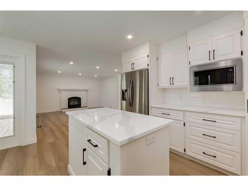 420 Diamond Court Se, Calgary, AB - Indoor Photo Showing Kitchen With Fireplace