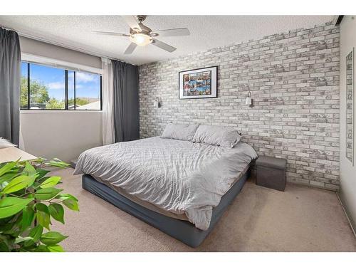 1844 Meadowbrook Drive Se, Airdrie, AB - Indoor Photo Showing Bedroom