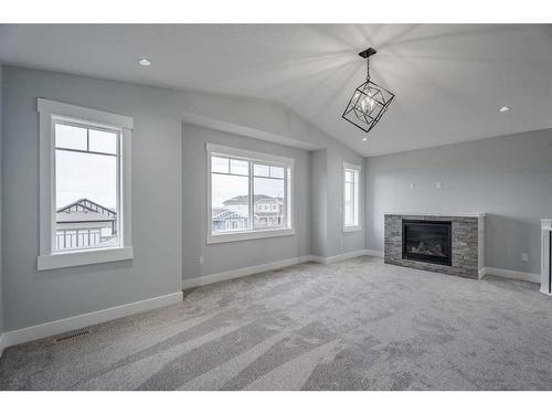 1362 Scarlett Ranch Boulevard, Carstairs, AB - Indoor Photo Showing Living Room With Fireplace