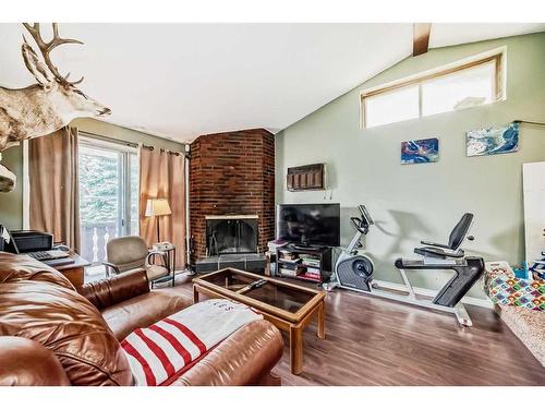 8827 33 Avenue Nw, Calgary, AB - Indoor Photo Showing Living Room With Fireplace