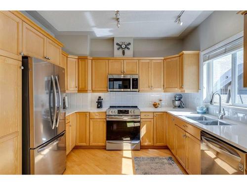 11 Sierra Morena Landing Sw, Calgary, AB - Indoor Photo Showing Kitchen With Double Sink