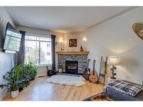 11 Sierra Morena Landing Sw, Calgary, AB - Indoor Photo Showing Living Room With Fireplace