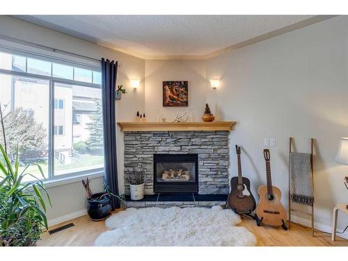 11 Sierra Morena Landing Sw, Calgary, AB - Indoor Photo Showing Living Room With Fireplace