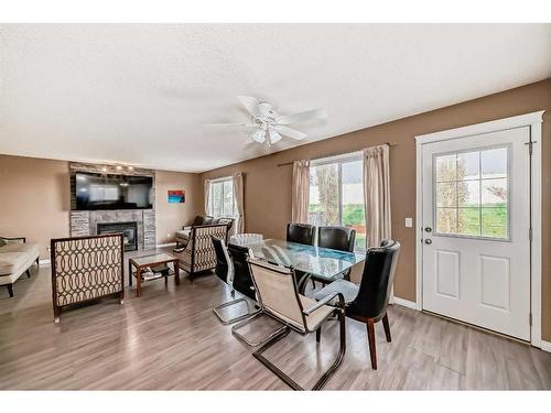 187 Silver Springs Way Nw, Airdrie, AB - Indoor Photo Showing Dining Room With Fireplace