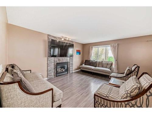 187 Silver Springs Way Nw, Airdrie, AB - Indoor Photo Showing Living Room With Fireplace