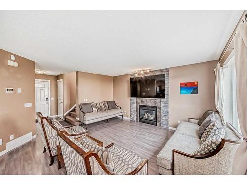 187 Silver Springs Way Nw, Airdrie, AB - Indoor Photo Showing Living Room With Fireplace