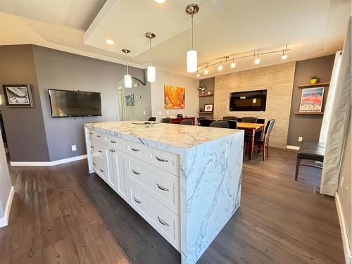 24 Thornleigh Way Se, Airdrie, AB - Indoor Photo Showing Kitchen With Upgraded Kitchen