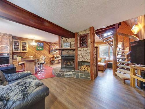 526 1St Street, Canmore, AB - Indoor Photo Showing Living Room With Fireplace