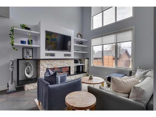 2007 24 Avenue Nw, Calgary, AB - Indoor Photo Showing Living Room With Fireplace