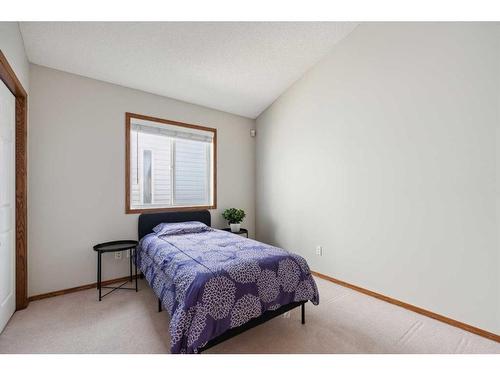 52 Arbour Crest Drive Nw, Calgary, AB - Indoor Photo Showing Bedroom