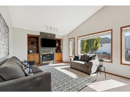 52 Arbour Crest Drive Nw, Calgary, AB - Indoor Photo Showing Living Room With Fireplace