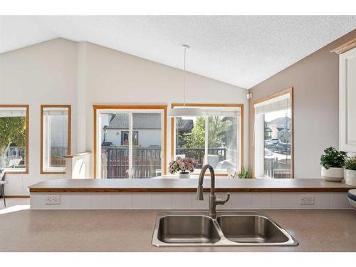 52 Arbour Crest Drive Nw, Calgary, AB - Indoor Photo Showing Kitchen With Double Sink
