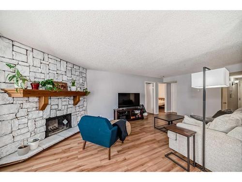 201-1625 14 Avenue Sw, Calgary, AB - Indoor Photo Showing Living Room With Fireplace