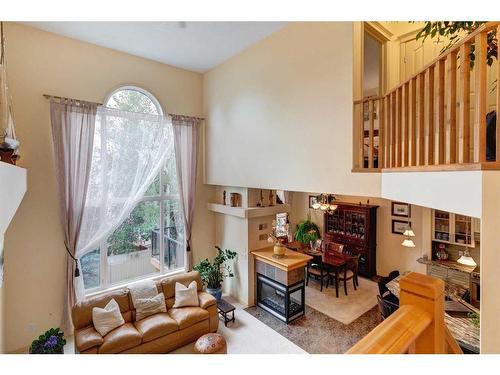 73 Cresthaven Way Sw, Calgary, AB - Indoor With Fireplace