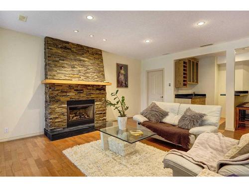 73 Cresthaven Way Sw, Calgary, AB - Indoor Photo Showing Living Room With Fireplace