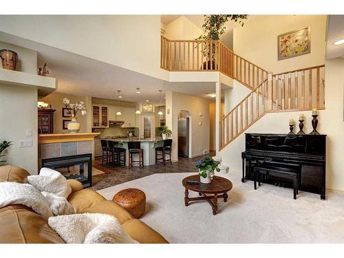73 Cresthaven Way Sw, Calgary, AB - Indoor Photo Showing Living Room With Fireplace