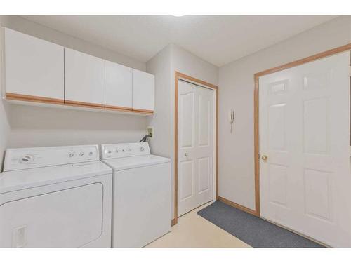 64 Coral Springs Boulevard Ne, Calgary, AB - Indoor Photo Showing Laundry Room