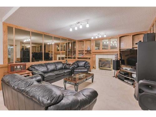 64 Coral Springs Boulevard Ne, Calgary, AB - Indoor Photo Showing Living Room With Fireplace