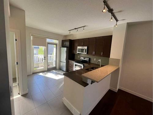 105 Sherwood Row Nw, Calgary, AB - Indoor Photo Showing Kitchen With Double Sink