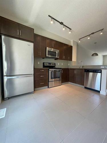 105 Sherwood Row Nw, Calgary, AB - Indoor Photo Showing Kitchen With Stainless Steel Kitchen