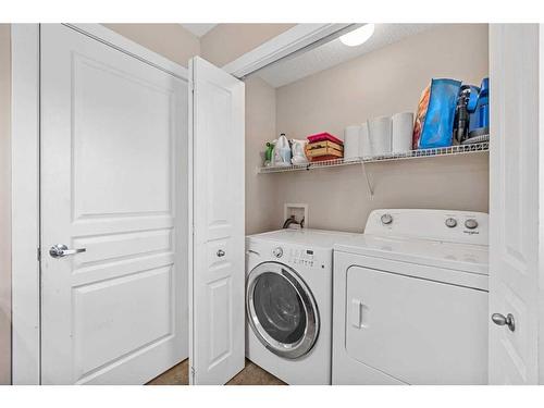 74 Cimarron Vista Gardens, Okotoks, AB - Indoor Photo Showing Laundry Room