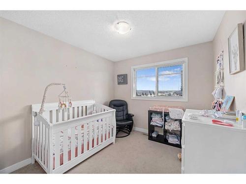 74 Cimarron Vista Gardens, Okotoks, AB - Indoor Photo Showing Bedroom