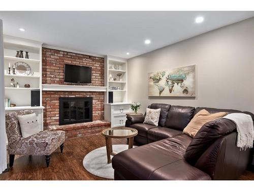 240 Woodridge Place Sw, Calgary, AB - Indoor Photo Showing Living Room With Fireplace