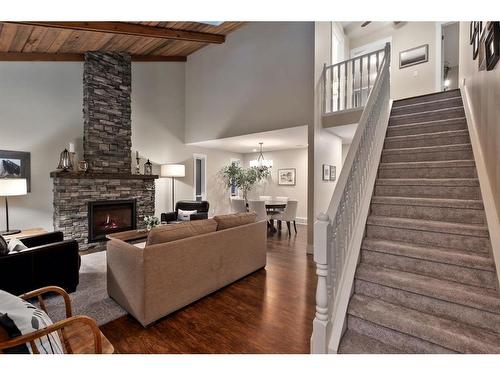 240 Woodridge Place Sw, Calgary, AB - Indoor Photo Showing Other Room With Fireplace