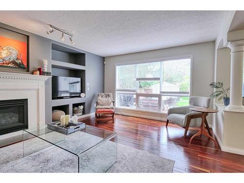 243 Mt Selkirk Close Se, Calgary, AB - Indoor Photo Showing Living Room With Fireplace