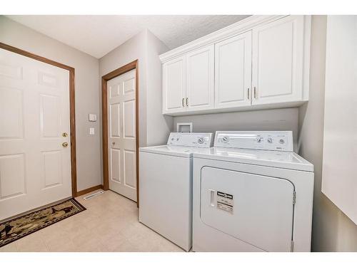 28 Eagleview Gate, Cochrane, AB - Indoor Photo Showing Laundry Room