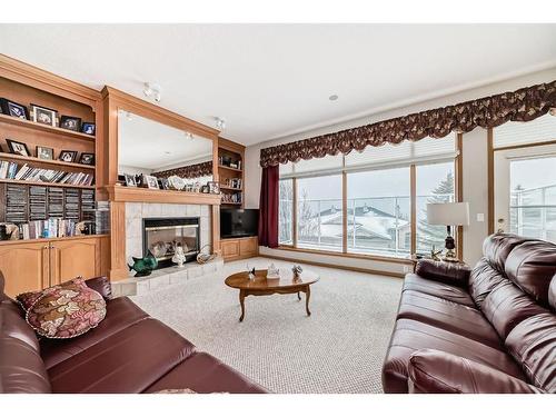 28 Eagleview Gate, Cochrane, AB - Indoor Photo Showing Living Room With Fireplace
