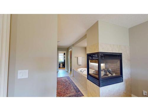 202 Chapala Point Se, Calgary, AB - Indoor With Fireplace
