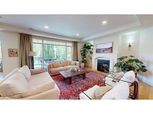 202 Chapala Point Se, Calgary, AB - Indoor Photo Showing Living Room With Fireplace