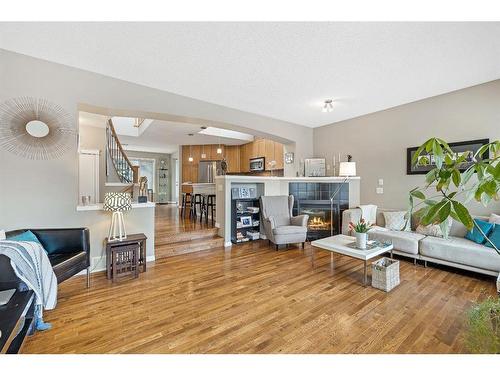 57 Auburn Bay View Se, Calgary, AB - Indoor Photo Showing Living Room With Fireplace