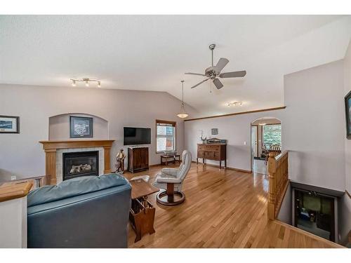 48 Fairways Drive Nw, Airdrie, AB - Indoor Photo Showing Living Room With Fireplace