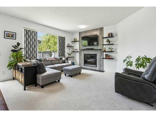147 Royal Oak Mews Nw, Calgary, AB - Indoor Photo Showing Living Room With Fireplace