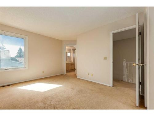 83 Coachway Gardens Sw, Calgary, AB - Indoor Photo Showing Other Room