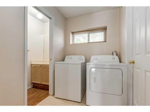 83 Coachway Gardens Sw, Calgary, AB - Indoor Photo Showing Laundry Room