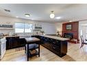 8824 33 Avenue Nw, Calgary, AB  - Indoor Photo Showing Kitchen With Fireplace 