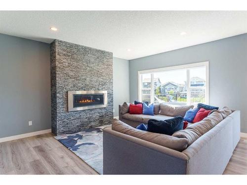 2237 Bayside Road Sw, Airdrie, AB - Indoor Photo Showing Living Room With Fireplace