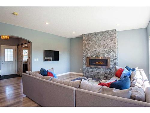 2237 Bayside Road Sw, Airdrie, AB - Indoor Photo Showing Living Room With Fireplace