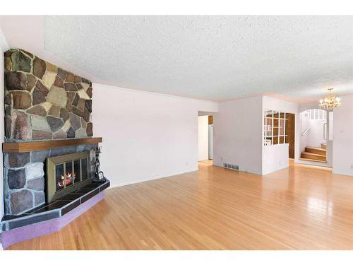 35 Glenview Drive Sw, Calgary, AB - Indoor Photo Showing Living Room With Fireplace