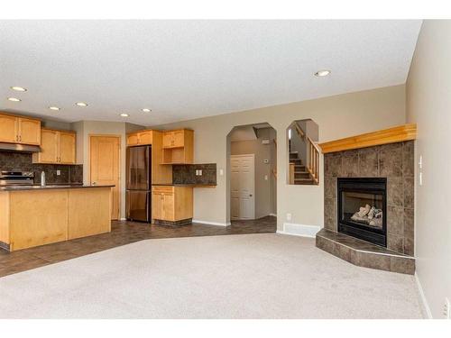 107 Brightondale Crescent Se, Calgary, AB - Indoor With Fireplace