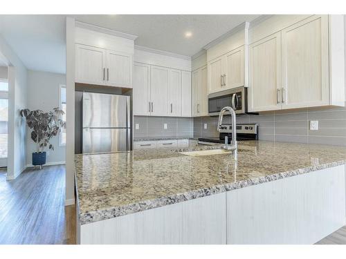 51 Willow Crescent, Okotoks, AB - Indoor Photo Showing Kitchen With Upgraded Kitchen