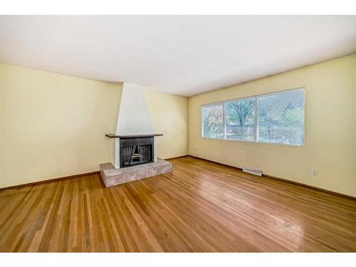 9815 2 Street Se, Calgary, AB - Indoor Photo Showing Living Room With Fireplace