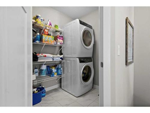 142 Livingston Common Ne, Calgary, AB - Indoor Photo Showing Laundry Room