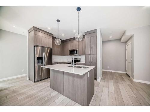 1307-681 Savanna Boulevard Ne, Calgary, AB - Indoor Photo Showing Kitchen With Stainless Steel Kitchen With Upgraded Kitchen